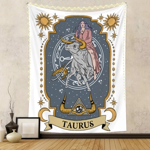 Artistic Taurus zodiac wall tapestry with moon and sun motifs in a home interior setting