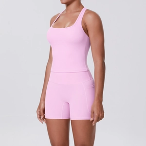 Close-up of pink high-waist fitness shorts featuring a practical side pocket detail