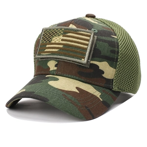 Detailed view of tactical camouflage baseball cap with USA flag velcro patch and mesh back