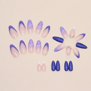 Almond-shaped press-on nails featuring Morandi purple French tips and blue glitter accents