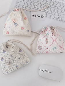 Cute cartoon drawstring storage bags in seersucker fabric with rabbit and floral patterns