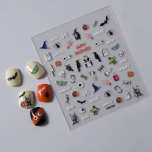 Detail of Halloween nail art decals featuring pumpkin, witch, and bat motifs on light base
