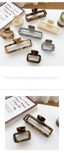 Detail of acetate hair claws in marble and tortoiseshell patterns with sizing info