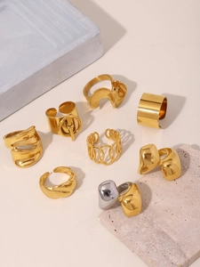 Collection of minimalist 18K gold-plated stainless steel rings in various geometric designs