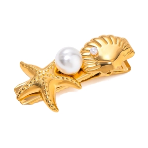 Golden starfish and seashell hair clip with elegant faux pearls on a white background