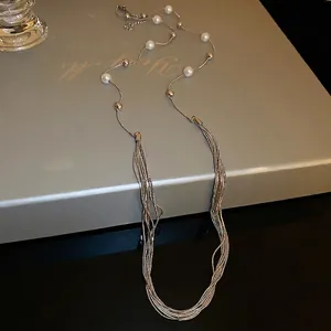 Elegant multi-layered long pearl necklace with layered metal chains for women
