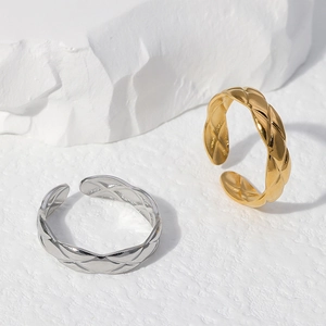 Minimalist adjustable stainless steel rings featuring classic quilted pattern in gold and silver