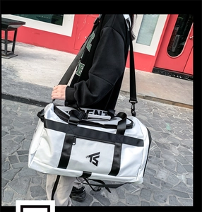 Macro detail of white oxford backpack with black adjustable strap and brand logo