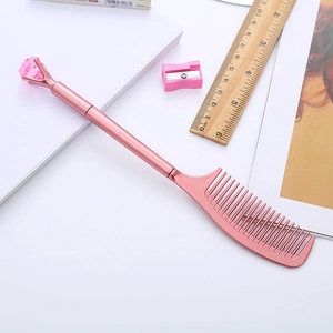 Bolígrafo único en forma de peine oro rosa con diamante rosa grande y púas finas