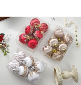 Detailed view of 18 festive Christmas ornaments in red, gold, and white with varied textures