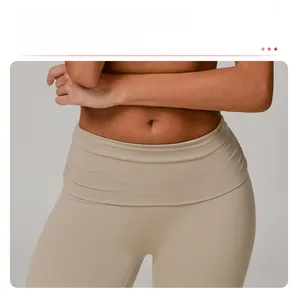 Detail of high-waisted nude yoga pants featuring a seamless front for a smooth look