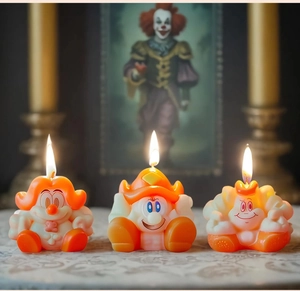 Three lit cartoon warrior candles with warm flames and detailed orange and white textures