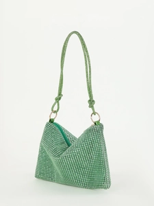 Detail of green rhinestone knotted hobo bag with sparkling crystals and silver zipper closure