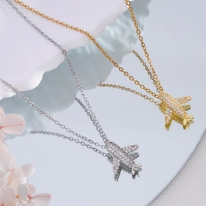 Luxurious 18K gold and silver airplane necklaces with sparkling zircon pavé pendants