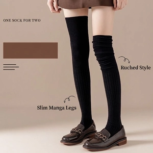 Black vertical stripe knit over-the-knee socks with versatile slouchy styling