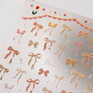 3D bow and tulip nail stickers with elegant gold stamping and pink star designs