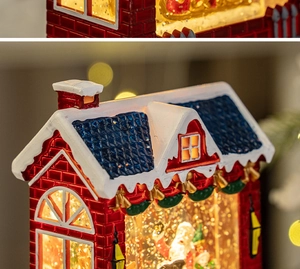 Close-up of vintage red Christmas lantern with Santa scene and glowing snow effect