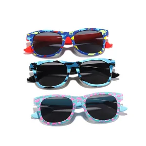Three pairs of kids sunglasses with dinosaur, camouflage and watermelon patterns