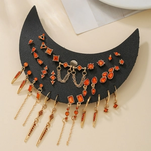 Parure de boucles d'oreilles gothiques dorées avec pierres ambre sur support lune
