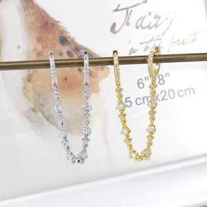 Detail of S925 silver needle drop earrings with sparkling colorful zircon tassels