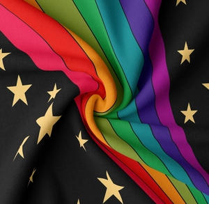 Detailed macro view of woven rainbow stripes and gold star pattern on fabric tapestry
