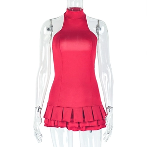 Detail view of red sleeveless halter pleated mini dress showing layered tiered skirt texture
