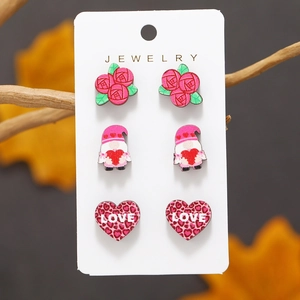 Valentine wooden stud earring set featuring rose, gnome, and leopard love heart designs