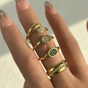 Set of four 18k gold plated stainless steel rings with green and white zircons