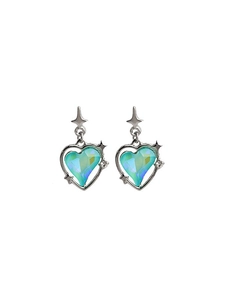 Detailed macro of silver heart stud earrings with blue gradient crystal and star charm