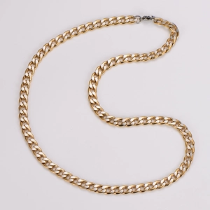 Close-up of golden stainless steel cuban chain link necklace with lobster clasp