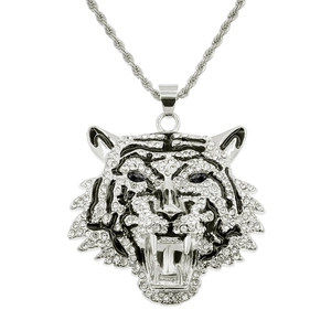 Detail of silver tiger head pendant with green eyes and sparkling rhinestones
