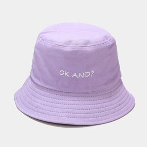 Detail of lavender cotton bucket hat with white OK AND? embroidery and stitched brim