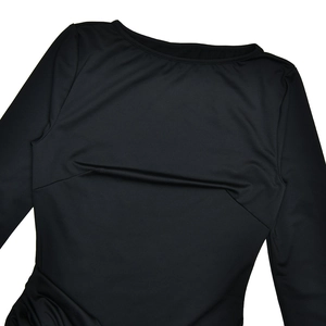 Detail of black long sleeve dress featuring crew neck and bodycon waist ruching