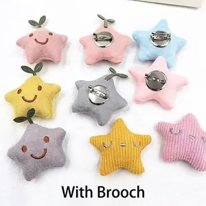 Star-shaped plush corduroy brooches with embroidered smiley faces in various pastel colors