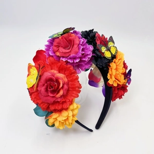 Detail of Mexican day of the dead headband with colorful faux roses and 3D butterflies
