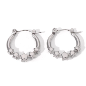 Macro shot of silver stainless steel hoop earrings featuring five 3D star charms on the base