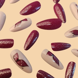 Long almond press-on nails with purple glitter and butterfly designs on nude base
