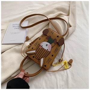 Detail of cartoon rabbit themed brown crossbody bag with bear prints and shoulder strap