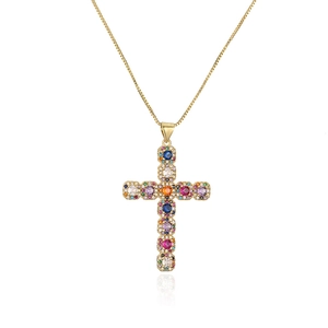 Detailed view of a gold-plated cross necklace with colorful rainbow zircons and clear stones