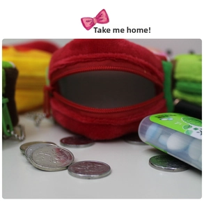 Detail of red plush coin purse with a silver chain and a smooth zipper closure