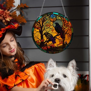 Close-up of stained glass style raven hanging decor with autumn scene and chain