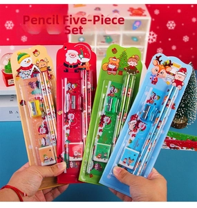 Close-up of four Christmas stationery sets with pencils, rulers, and erasers in hand