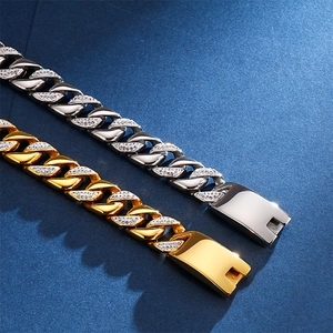 Macro view of gold and silver Cuban link bracelets with micro-pave zircon crystals