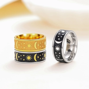 Macro shot of 8mm stainless steel moon and star sun rings in gold and black finishes