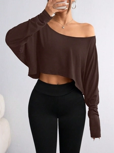 Detail of off-shoulder long sleeve top in brown fabric showing slim fit texture
