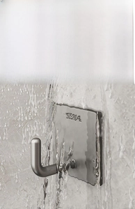 Close-up of SUS304 stainless steel adhesive hook showing water resistance and durability