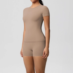 Detail shot of solid color brushed athletic set featuring high-stretch shorts and top