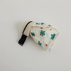 Detail of floral quilted pet hat with adjustable strap and soft knit lining texture