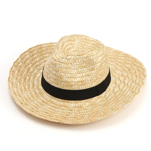 Classic straw sun hat with black ribbon band for beach travel, wide brim Panama style