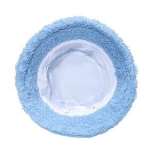 Detail view of light blue fuzzy bucket hat with warm fleece texture and interior lining